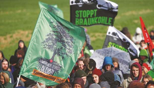 Activists protest for the preservation of the Hambacher Forst (forest), near the western German town of Kerpen-Buir, west of Cologne. The banners read u2018Hambacher Forst staysu2019 and u2018Stop brown coalu2019.