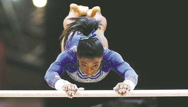Simone Biles of the US competes in the womenu2019s Uneven Bar qualification at the 2018 FIG Artistic World Gymnastics Championships at Aspire Dome in Doha yesterday. (AFP)