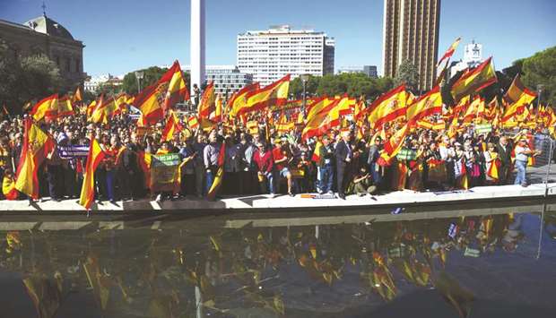 Pro-Spain demonstrators wave Spanish national flags in Colon Square during a protest for Spanish unity in Madrid on October 28, 2017. The Catalan regionu2019s economy, which accounts for around a fifth of Spainu2019s economic output, grew by 3.1% in the second quarter of 2018, outperforming Spain as a whole which expanded only 2.5%.