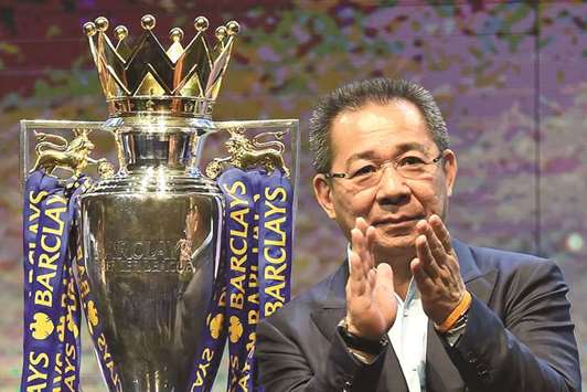 In this file photo taken on May 18, 2016 Leicester City FCu2019s owner Vichai Srivaddhanaprabha applauds as they take part in a presentation of the English Premier League football trophy at the King Power duty-free headquarters in Bangkok.