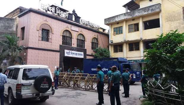Bangladeshi police stand guard in front of a jail-turned-court where a verdict was being delivered on a graft case against Bangladesh opposition leader Khaleda Zia in Dhaka