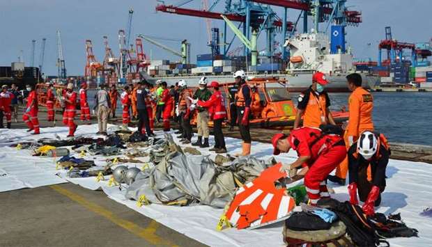 Rescue team members arrange Lion Air flight JT610 wreckage at Tanjung Priok port in Jakarta