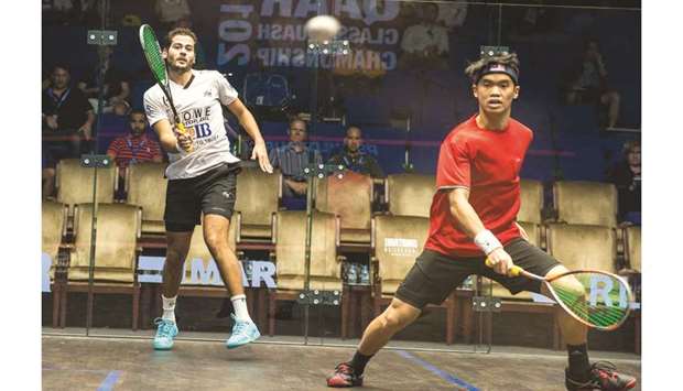 Karim Abdel Gawad (L) plays a shot as Eain Yow Ng waits for the ball during their third round match at the Qatar Classic yesterday.  PICTURE: Jayan Orma