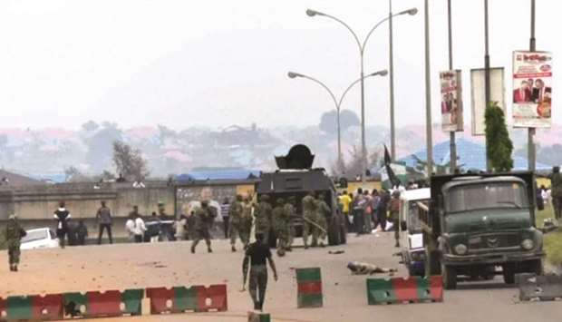 Soldiers behind an armoured vehicle advance on Islamic Movement of Nigeria protesters in this still image taken from a video shot yesterday on the outskirts of Abuja, Nigeria.