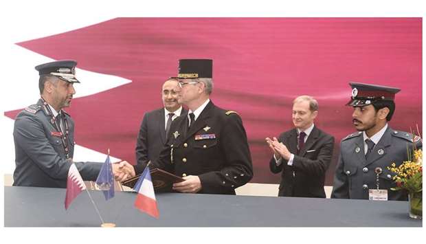 Director General of the French Gendarmerie Richard Lizurey and Assistant Commander of Qataru2019s Lakhwiya exchanging documents after signing a memorandum of understanding yesterday at the Milipol Qatar 2018 exhibition. Visiting French Minister for Interior Laurent Nunez and Franceu2019s ambassador to Qatar Fraanck Gellet were present at the signing. PICTURE: Shaji Kayamkulam