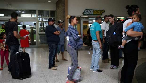 A pregnant woman from Honduras is released from detention with other undocumented immigrants at a bus depot in McAllen, Texas, US. July 28, 2018 file picture