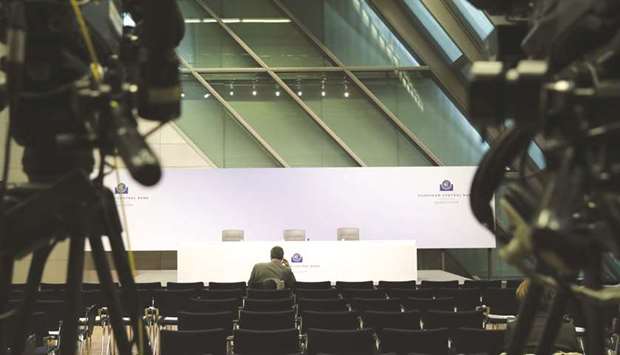 A solitary journalist awaits the start of the ECB rate decision news conference in Frankfurt on October 25. Yesterdayu2019s data, suggesting the slowdown has further to run, will make uncomfortable reading for the ECB as it moves towards ending in December the programme of asset purchases it introduced in 2015 to boost inflation and economic growth.