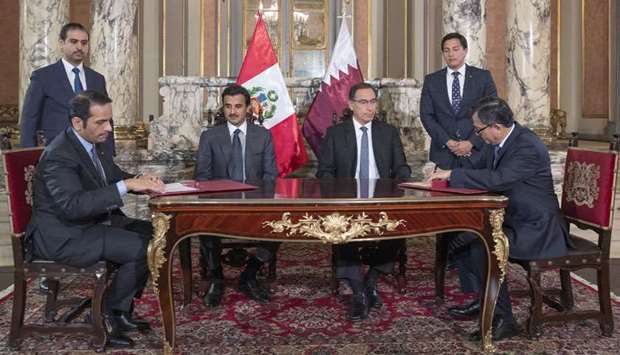 His Highness the Amir Sheikh Tamim bin Hamad al-Thani and Peru President Martin Vizcarra witness the signing of an agreement between the foreign ministries of Qatar and Peru at the Presidential Palace in Lima