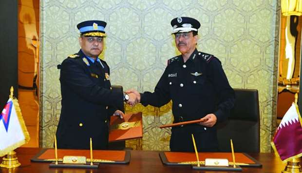 Qatar's Director General of Public Security Staff Major General Saad bin Jassim al-Khulaifi and Inspector General of Nepal Police Sarbendra Khanal at the signing of a Letter of Intent.