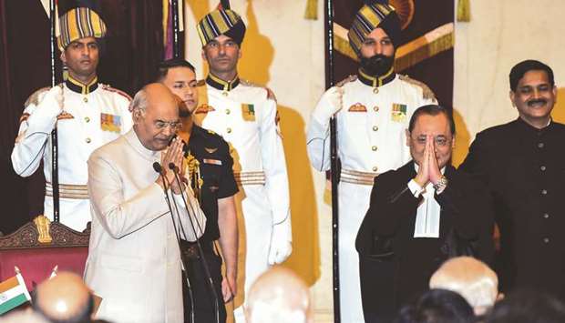 In-coming Chief Justice of India Justice Ranjan Gogoi greets dignitaries ahead of taking oath in the presence of President Ram Nath Kovind inside the Durbar Hall at the presidential palace in New Delhi yesterday.