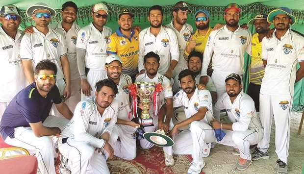 Warriors Club players pose with the trophy after winning the QCA Twenty20 Cricket Tournament.