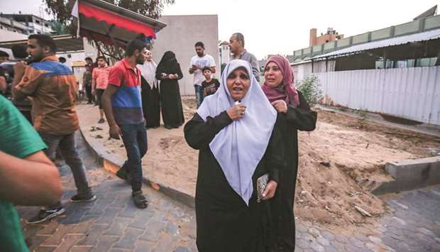 The aunt of slain 15-year-old Palestinian Ahmed Abu Habel, who was killed during clashes with Israeli forces near the Erez border crossing with Israel, reacts outside a hospital morgue in Beit Lahia in the northern Gaza Strip, yesterday.