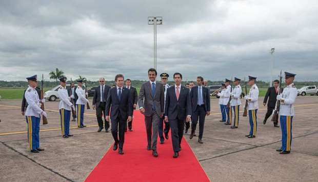His Highness the Amir Sheikh Tamim bin Hamad al-Thani is being greeted on arrival at a reception ceremony at Asuncion airport.
