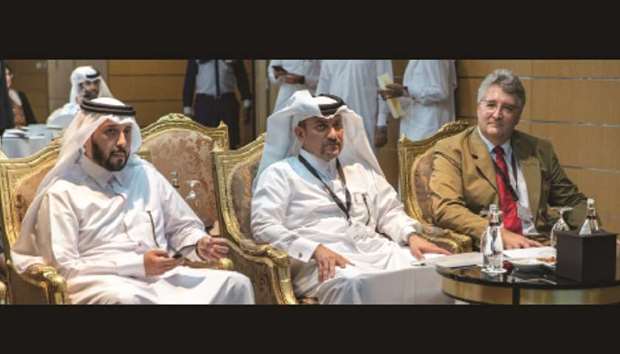 Mansoor bin Ebrahim al-Mahmoud, Ahmad al-Namla, and Dr Sam Evans.