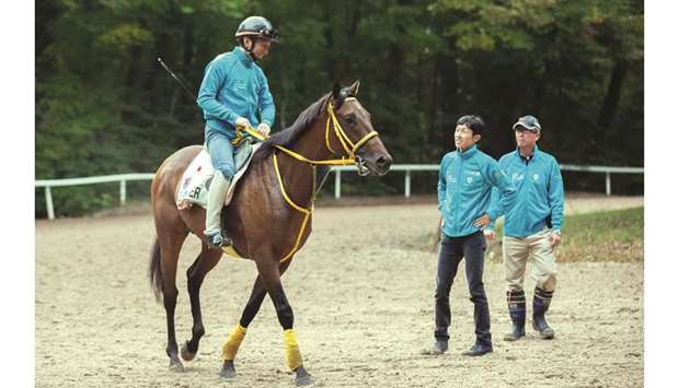 Trainer Hiroshi Miyamoto and jockey Yutaka Take oversee Japanese horse Clincheru2019s training session in Chantilly yesterday.
