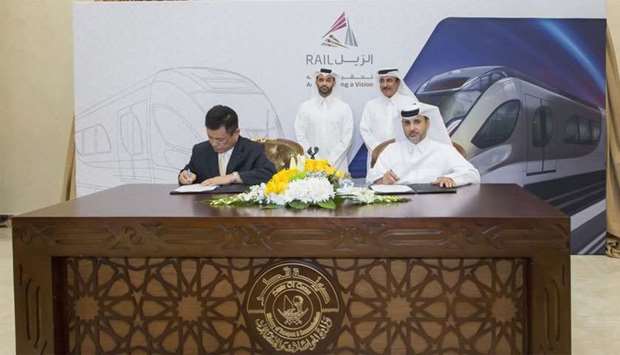 HE Jassim Seif Ahmed al-Sulaiti with other dignitaries at the signing of the agreement for 35 additional trains for the Doha Metro.