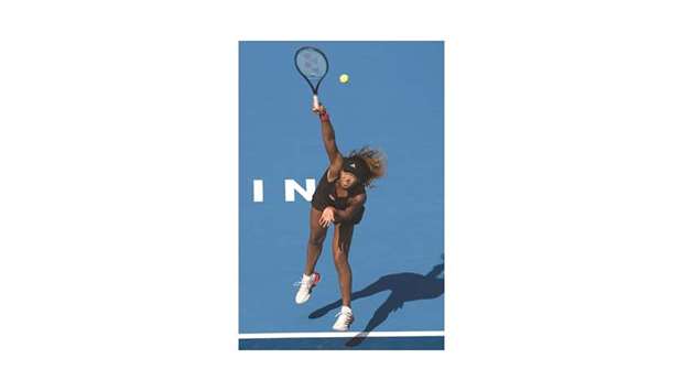 Naomi Osaka of Japan serves during her third round match against Julia Goerges of  Germany at the China Open tennis tournament in Beijing.