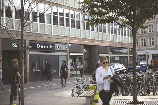 Customers use an ATM outside a Danske Bank branch in Copenhagen. Danske Bank said it had u201creceived requests for information from the US Department of Justice in connection with a criminal investigation relating to the banku2019s Estonian branchu201d.