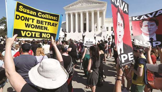 Activists rally in opposition to US Supreme Court nominee Brett Kavanaugh, outside the court in Washington.