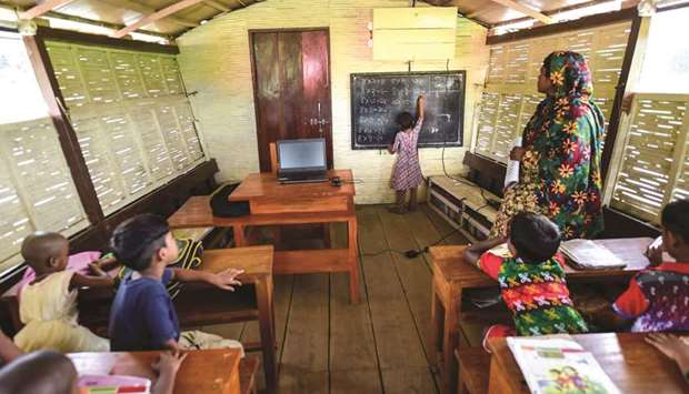 Students attend a u201cfloating schoolu201d in Chalan Beel in Rajshahi district.