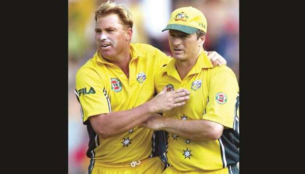 A file photo taken on January 29, 2002 shows Australian spinner Shane Warne (L) and captain Steve Waugh celebrating taking the wicket of New Zealand batsman Chris Cairns during an ODI match played at the MCG.