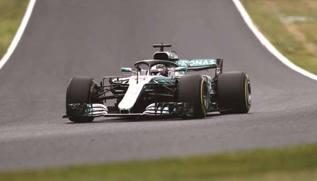 Mercedes driver Lewis Hamilton competes during the second practice session for the Japanese Grand Prix at Suzuka yesterday. (AFP)