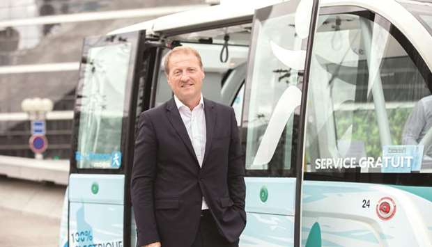 Christophe Sapet, CEO of Navya Technologies, stands beside an Arma autonomous shuttle bus in Paris. With Navya, Sapet faces obstacles on financing and a fragmented European market, highlighting the issues persistently holding back Franceu2019s startups from becoming global champions.