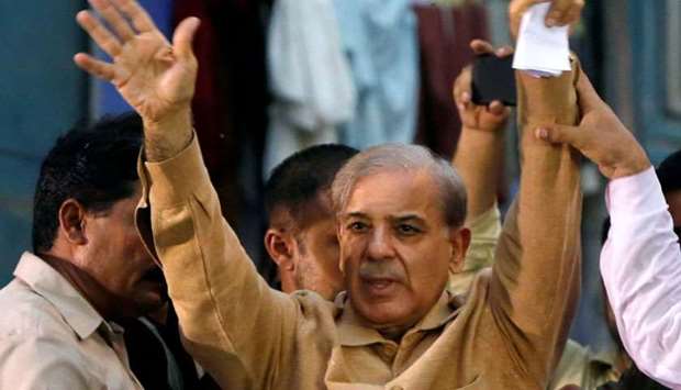 Shahbaz Sharif, brother of ex-prime minister Nawaz Sharif, and leader of Pakistan Muslim League - Nawaz (PML-N) gestures to his supporters during a campaign rally ahead of general elections in the Lyari neighborhood in Karachi on June 26.
