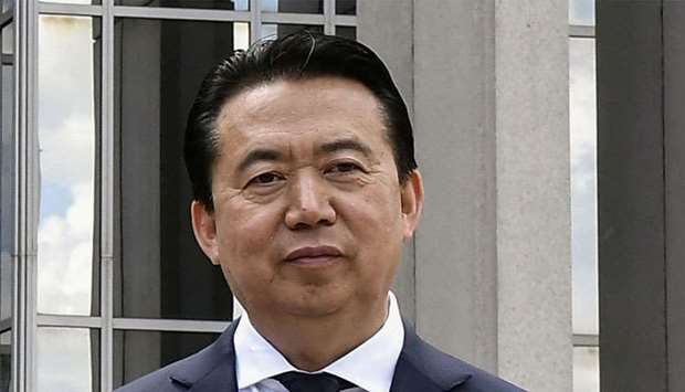 President Meng Hongwei poses during a visit to the headquarters of International Police Organisation in Lyon, France, on May 8