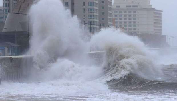 Waves crash into a sea wall during heavy swells from typhoon Kong-rey, on Jeju island