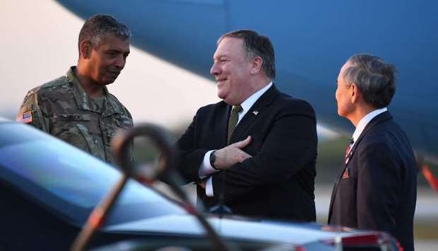 US Secretary of State Mike Pompeo (C) talks with US ambassador to South Korea Harry Harris (R) and US General Vincent K. Brooks (L), commander of United States Forces Korea, upon his arrival at Osan Air Base in Pyeongtaek.