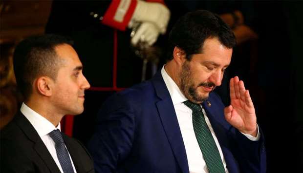 Interior Minister Matteo Salvini gestures next to Italy's Minister of Labor and Industry Luigi Di Maio at the Quirinal palace in Rome, Italy, June 1, 2018.