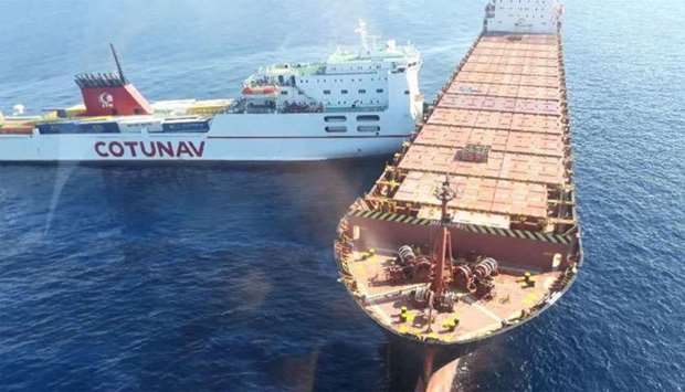 A roll-on/roll-off ferry (L) and a container ship after they collided off the northwest coast of Cap