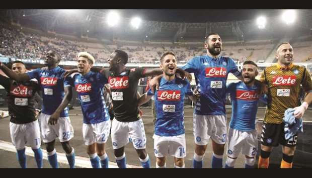 Napoli players celebrate in front of fans after their win over Sassuolo. (Reuters)