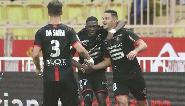 Rennes forward Hatem Ben Arfa (right) celebrates with teammates after scoring against Monaco. (AFP)