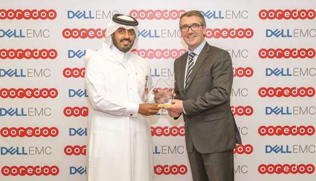 Ooredoo chief business officer Sheikh Nasser bin Hamad bin Nasser al-Thani receiving the award from Dell EMC president Europe, Middle East and Africa Aongus Hegarty.