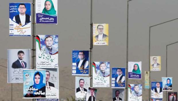Election posters of parliamentary candidates during the first day of election campaign in Kabul