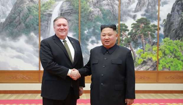 North Korea's leader Kim Jong Un (R) shaking hands with US Secretary of State Mike Pompeo at the Paekhwawon State Guesthouse in Pyongyang yesterday. AFP PHOTO/KCNA VIA KNS
