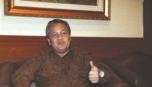 Bank Indonesiau2019s new governor Perry Warjiyo gestures during an interview in Jakarta. Indonesia, which is hosting the annual meetings of the International Monetary Fund and the World Bank Group, expects talks to cover rising US interest rates, as well as the global trade war and its impact on emerging markets, Warjiyo said.