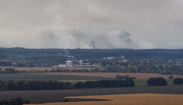 Smoke rises after a fire and explosions hit the Ukrainian defence ministry ammunition depot in the eastern Chernigov region
