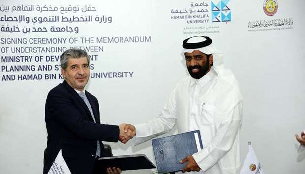 HE Minister for Development Planning and Statistics Dr. Saleh bin Mohammed Al Nabit and President of HBKU Dr. Ahmad M. Hasnah shake hands after signing the MoU. PHOTO: Shemeer Rasheed