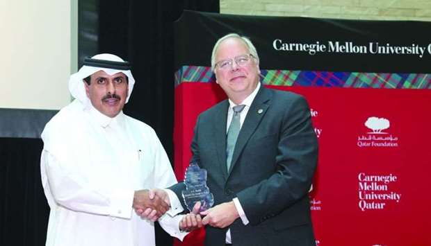 HE Sheikh Abdulla receives a token of recognition from Carnegie Mellon University in Qatar dean Trick during a lecture hosted by CMU-Q