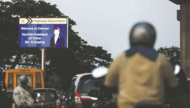 Commuters drive past a welcoming board for Chinau2019s President Xi Jinping in Chennai yesterday, ahead of a summit with Prime Minister Narendra Modi at the World Heritage Site of Mahabalipuram.