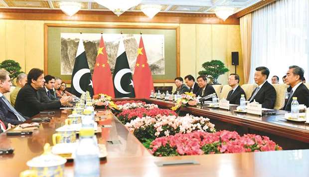 Pakistanu2019s Prime Minister Imran Khan talks to Chinese President Xi Jinping during their meeting at the Diaoyutai State Guesthouse in Beijing yesterday.