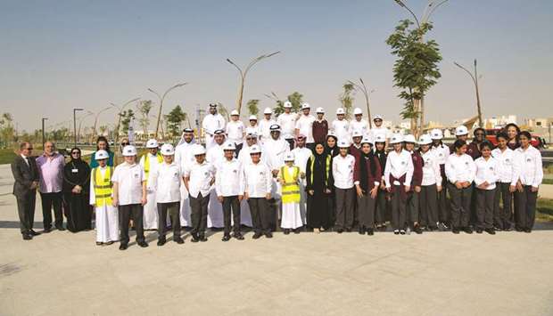 Students with officials of Ashghal and Supervisory Committee of Beautification of Roads and Public Places in Qatar.