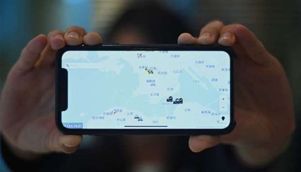 A smartphone displaying the ,HKmap.live, app in Hong Kong