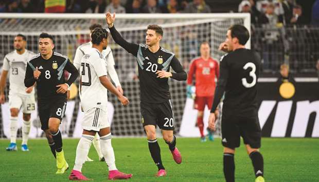 Argentinau2019s forward Lucas Alario (centre) celebrates scoring a goal during the friendly game against Germany at the Signal-Iduna Park in Dortmund. (AFP)
