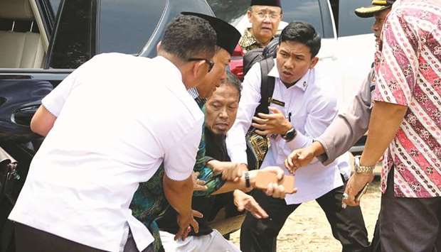 Indonesiau2019s Chief Security Minister Wiranto is pictured being attacked during his visit in Pandeglang, Banten province, Indonesia.