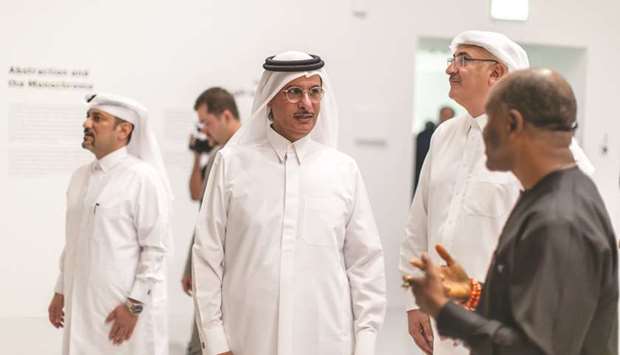 HE Sheikh Hassan bin Mohamed bin Ali al-Thani, who officially opened the u2018El Anatsui: Triumphant Scaleu2019 exhibition, was briefed by co-curator, professor Chika Okeke-Agulu (right).