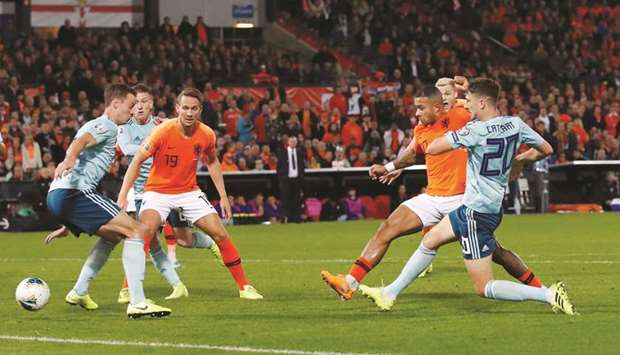 Netherlandsu2019 Memphis Depay (second right) scores against Northern Ireland during the Euro 2020 Qualifier Group C match in Rotterdam on Thursday night. (Reuters)